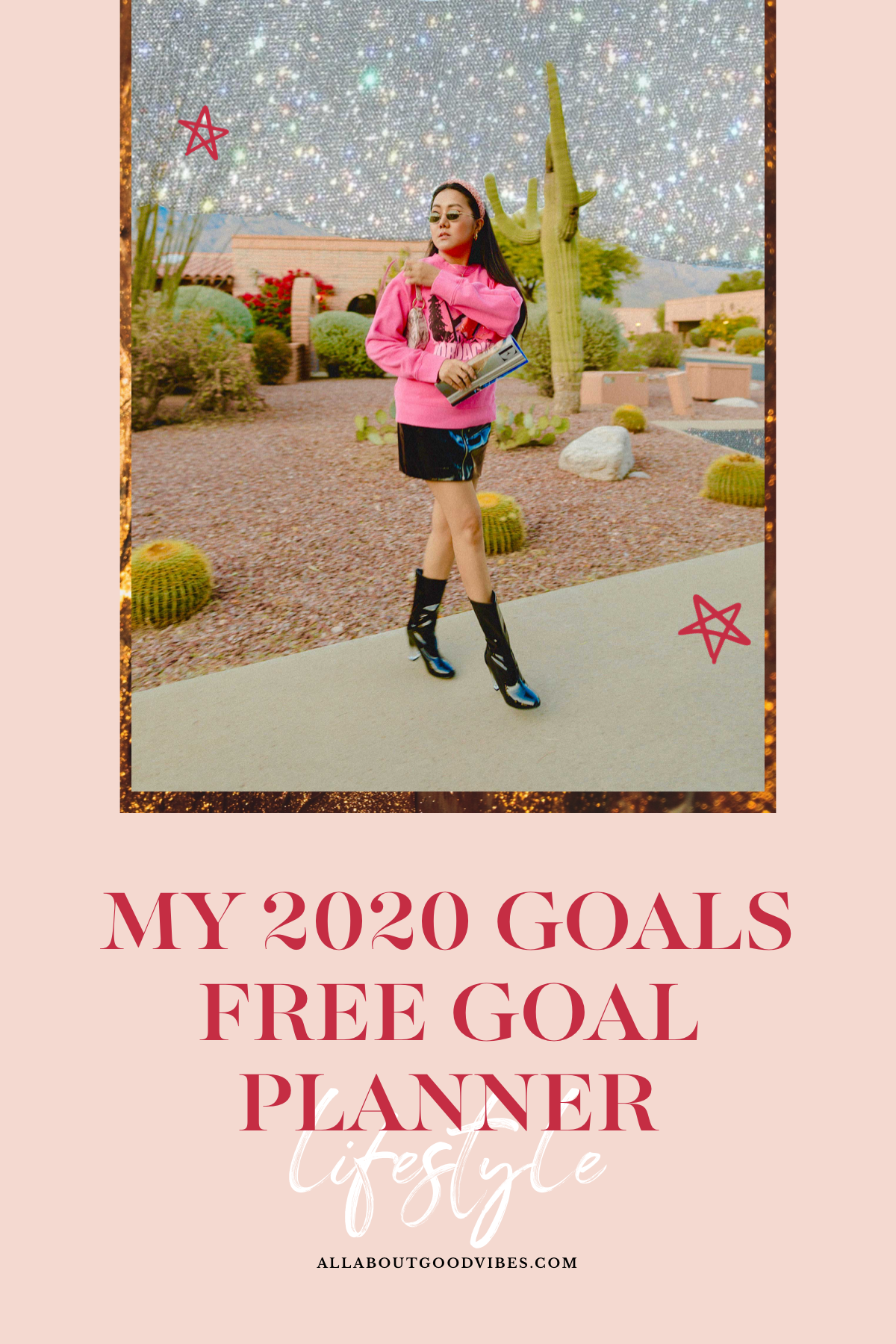 Molly Larsen lifestyle blogger standing in front of cactus in a pink top and black skirt holding a magazine and wearing sunglasses and black boots Smart goals 2020 goals what are smart goals planners
